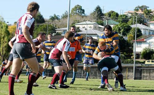 Dan Dixon is tackled by a Noosa defender while team-mate Andrew Rye stands in support. Gympie’s only try from the brutal encounter went to Dixon. Dan Dixon is tackled by a Noosa defender while team-mate Andrew Rye stands in support. Gympie’s only try from the brutal encounter went to Dixon.